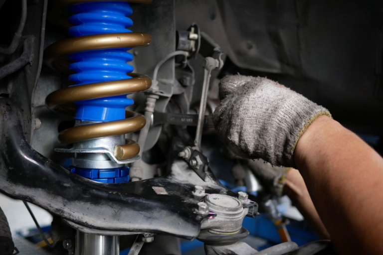 Coilover suspension being fitted to a car